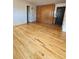 Spacious living room features gleaming hardwood floors and a convenient Murphy bed at 1131 N Lafayette St # 304, Denver, CO 80218
