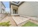 Inviting back patio with sliding door, perfect for outdoor relaxation and entertaining in a low maintenance space at 8911 Eagle River St, Littleton, CO 80125