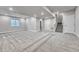 Finished basement with carpet, recessed lighting, and staircase at 8911 Eagle River St, Littleton, CO 80125