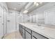 Bathroom featuring double sinks and glass-enclosed shower at 8911 Eagle River St, Littleton, CO 80125