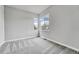 Neutral bedroom with carpet and window views at 8911 Eagle River St, Littleton, CO 80125