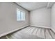 Neutral bedroom with gray carpet and a bright window at 8911 Eagle River St, Littleton, CO 80125