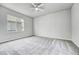 Bright and spacious bedroom with neutral walls and carpet at 8911 Eagle River St, Littleton, CO 80125