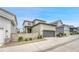 Charming two-story home with neutral paint, a two car garage, and a well-manicured landscape at 8911 Eagle River St, Littleton, CO 80125
