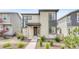 Modern two-story home with low maintenance front yard landscaping at 8911 Eagle River St, Littleton, CO 80125