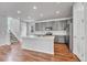 Modern kitchen with island and gray cabinets at 8911 Eagle River St, Littleton, CO 80125