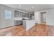 Well-lit kitchen featuring gray cabinets and a center island at 8911 Eagle River St, Littleton, CO 80125