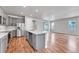 Open-concept kitchen with stainless steel appliances and a center island at 8911 Eagle River St, Littleton, CO 80125