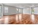Spacious living room area boasting stylish flooring and neutral color scheme at 8911 Eagle River St, Littleton, CO 80125