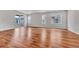 Expansive living room with sliding glass door and neutral walls at 8911 Eagle River St, Littleton, CO 80125
