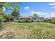 A large backyard with a deck, grill, dining area and lawn furniture for entertaining at 4855 E Atlantic Pl, Denver, CO 80222