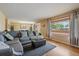 Spacious living room that flows into dining area, featuring hardwood floors and comfortable seating at 4855 E Atlantic Pl, Denver, CO 80222