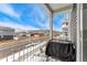 This balcony offers a view of the street with houses and garages lining the sidewalks at 18552 E 54Th Ave, Denver, CO 80249