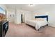 Bedroom with a cozy bed and minimal decor at 18552 E 54Th Ave, Denver, CO 80249