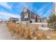 Charming two-story home with well-kept landscaping, offering curb appeal and a welcoming atmosphere at 18552 E 54Th Ave, Denver, CO 80249