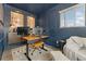 Well-appointed home office featuring a modern desk, stylish decor, and ample natural light at 18552 E 54Th Ave, Denver, CO 80249
