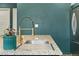 Kitchen featuring granite countertops, a stainless sink, and a modern faucet at 18552 E 54Th Ave, Denver, CO 80249
