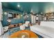 Spacious living room with modern decor, comfortable seating, and an open layout flowing into the kitchen at 18552 E 54Th Ave, Denver, CO 80249