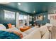 Living room features an oversized sectional, and sliding glass doors to balcony at 18552 E 54Th Ave, Denver, CO 80249