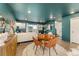 Cozy living room boasts modern decor, dining table and light wood flooring throughout at 18552 E 54Th Ave, Denver, CO 80249