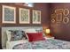 Close up of the main bedroom showing wall decor and comfortable bedding at 18552 E 54Th Ave, Denver, CO 80249