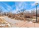 Paved pathway through the park, lined with trees and vegetation, offering a scenic route at 18552 E 54Th Ave, Denver, CO 80249