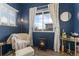 Comfortable sitting area with natural light, stylish furniture, and a mini fireplace at 18552 E 54Th Ave, Denver, CO 80249