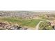 Aerial view of a golf course neighborhood, showcasing green fairways and residential homes at 26781 E Clifton Dr, Aurora, CO 80016