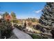 Landscaped backyard patio featuring a pergola and beautiful views beyond the yard at 26781 E Clifton Dr, Aurora, CO 80016
