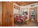 Cozy dining room with a custom wood ceiling, an elegant chandelier, and custom window treatments at 26781 E Clifton Dr, Aurora, CO 80016
