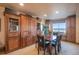 Formal dining room features a built-in china cabinet, a table with seating for four, and a window seat at 26781 E Clifton Dr, Aurora, CO 80016