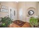 Welcoming foyer with hardwood floors, decorative rug, and elegant decor at 26781 E Clifton Dr, Aurora, CO 80016