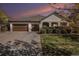 Charming single-Gathering home featuring a three-car garage and well-maintained landscaping under a colorful sky at 26781 E Clifton Dr, Aurora, CO 80016