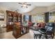 Cozy living room with a vaulted ceiling, many windows, and traditional wood built-ins at 26781 E Clifton Dr, Aurora, CO 80016