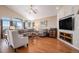 Spacious living room with large windows, hardwood floors, and stylish furnishings at 26781 E Clifton Dr, Aurora, CO 80016
