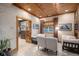Sunken living room with wood ceiling, tiled floor, bright sunlight, and open layout at 26781 E Clifton Dr, Aurora, CO 80016