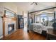 Primary bedroom showcasing a fireplace, vaulted ceiling, and a four-poster bed at 26781 E Clifton Dr, Aurora, CO 80016
