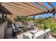 Outdoor patio featuring a pergola and comfortable seating, perfect for entertaining at 26781 E Clifton Dr, Aurora, CO 80016