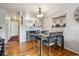 Cozy dining room with modern table set and stylish decor, adjacent to the kitchen area at 1818 S Quebec Way # 4, Denver, CO 80231