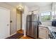 Updated kitchen boasts stainless appliances, granite counters, and a convenient pantry at 1818 S Quebec Way # 4, Denver, CO 80231