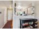 Updated kitchen with white cabinets, granite countertops, and stainless steel appliances at 1818 S Quebec Way # 4, Denver, CO 80231