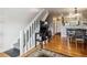Inviting living room featuring a staircase, hardwood floors, and seamless flow to other living areas at 1818 S Quebec Way # 4, Denver, CO 80231