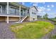 This backyard offers a deck and a grassy area at 22183 E Rocky Top Pl, Aurora, CO 80016