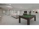 Open basement with a pool table, entertainment area, and ample space for recreation at 22183 E Rocky Top Pl, Aurora, CO 80016
