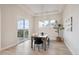 Dining room with modern chandelier and sliding glass door to the patio, for seamless indoor/outdoor experience at 22183 E Rocky Top Pl, Aurora, CO 80016