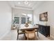 Inviting dining room bathed in natural light with backyard views, perfect for Gathering meals or dinner parties at 22183 E Rocky Top Pl, Aurora, CO 80016