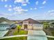 Beautiful home boasts a manicured lawn, stone accents, and a two-car garage at 22183 E Rocky Top Pl, Aurora, CO 80016