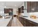Gourmet kitchen featuring sleek countertops, stainless steel appliances, and custom cabinetry at 22183 E Rocky Top Pl, Aurora, CO 80016