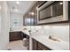 Kitchen area showcasing modern countertops, appliances, and recessed lighting at 22183 E Rocky Top Pl, Aurora, CO 80016