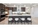 Modern kitchen showcasing a center island, stainless steel appliances, and hardwood floors at 22183 E Rocky Top Pl, Aurora, CO 80016